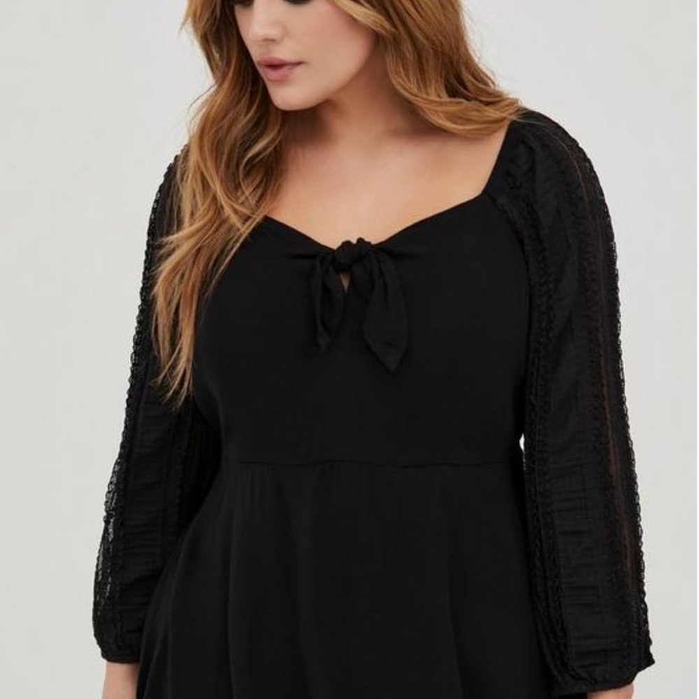 Torrid peplum swing top lace sleeves black.